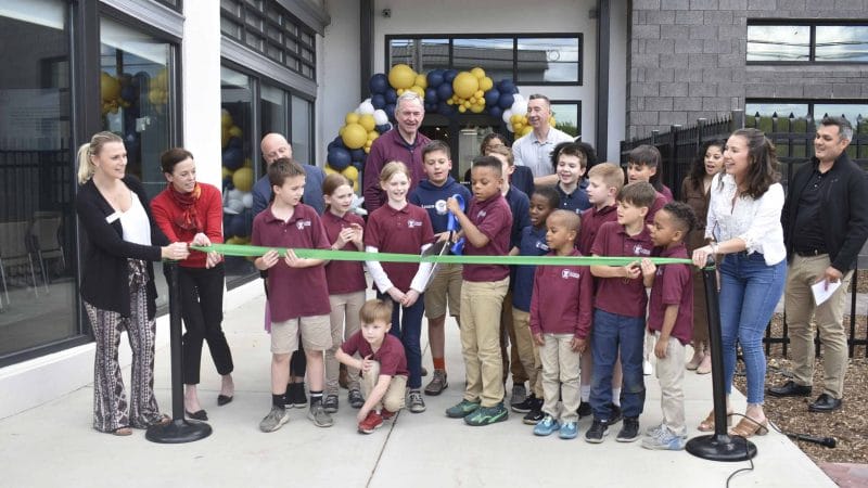 Logos Academy students cutting ribbon at campus expansion celebration